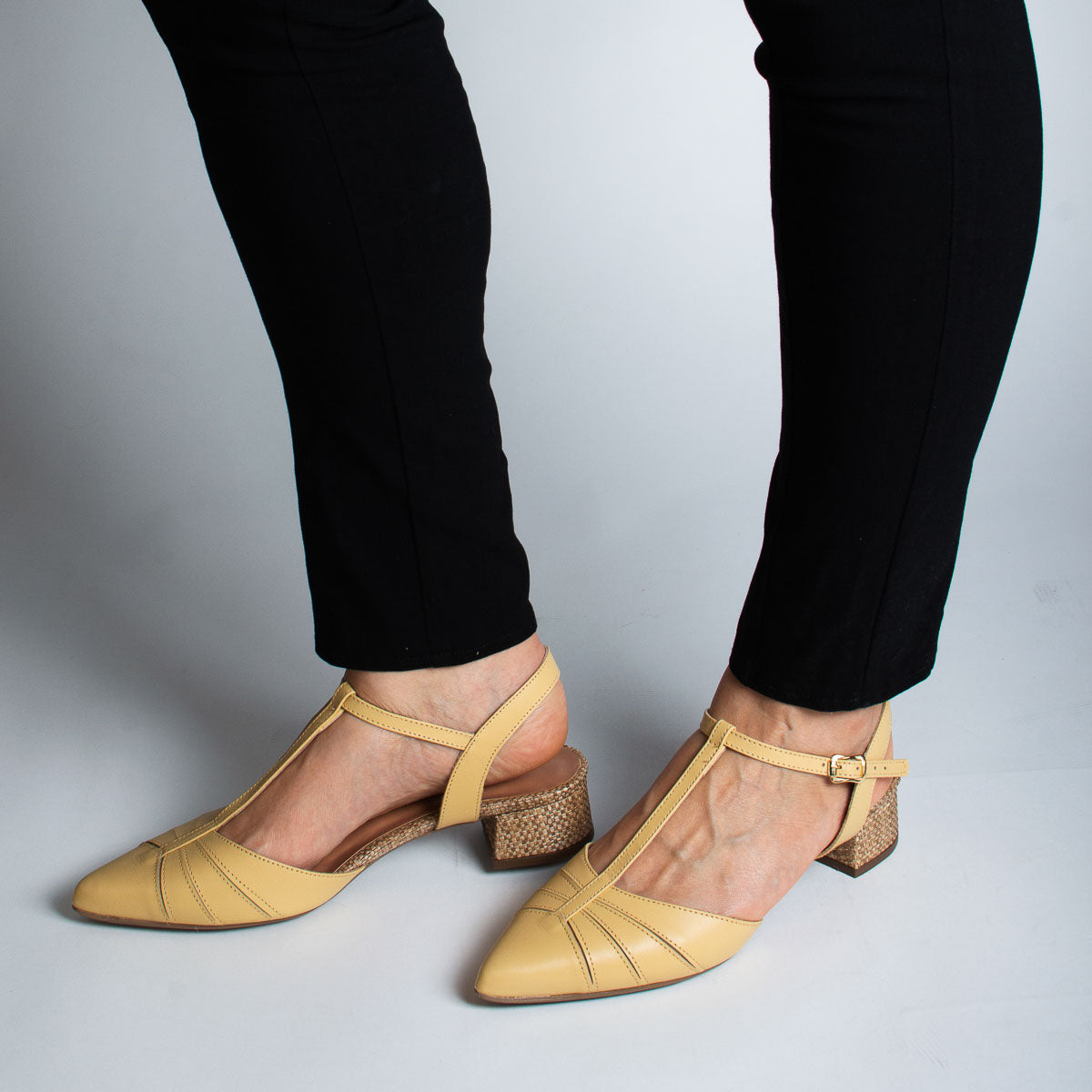 Woman wearing Margarida pumps with black trousers - lifestyle view