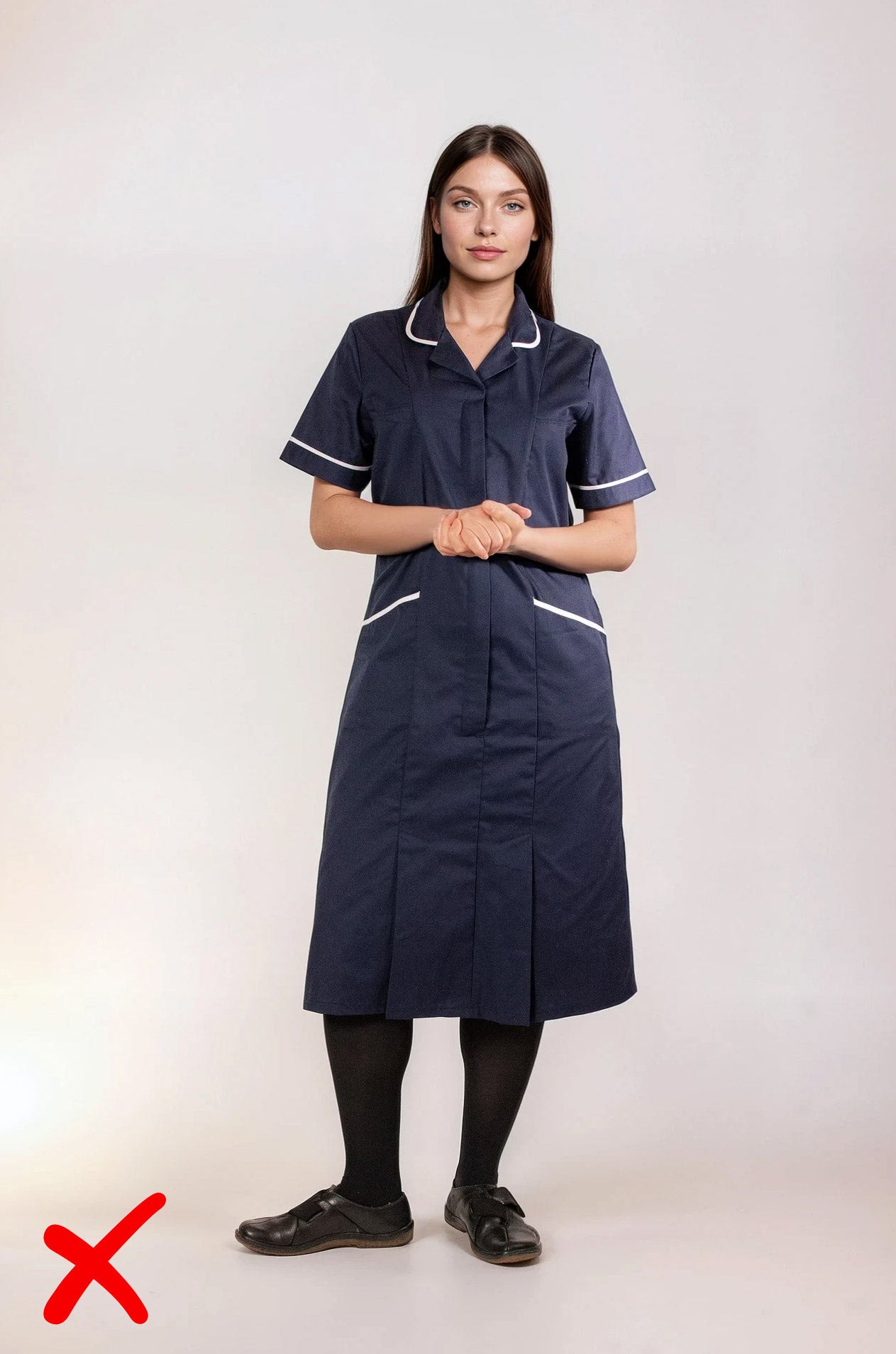 Avoid uncomfortable shoes - navy uniform dress with black tights and unsupportive footwear comparison