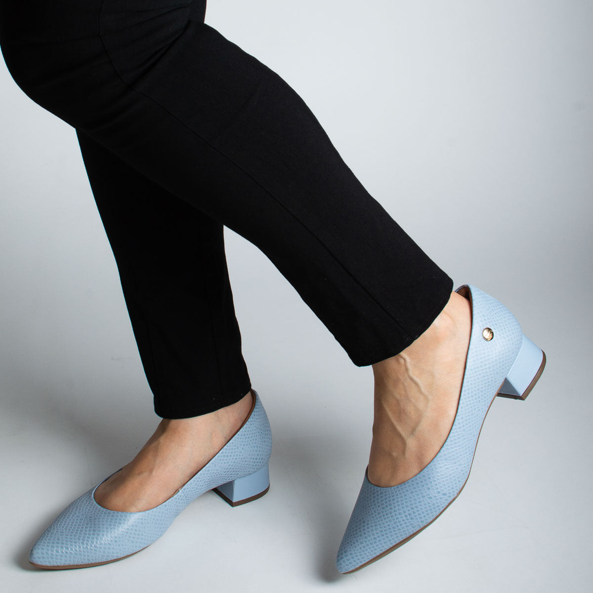 Woman wearing scale capri Orégano pumps with black trousers - lifestyle view