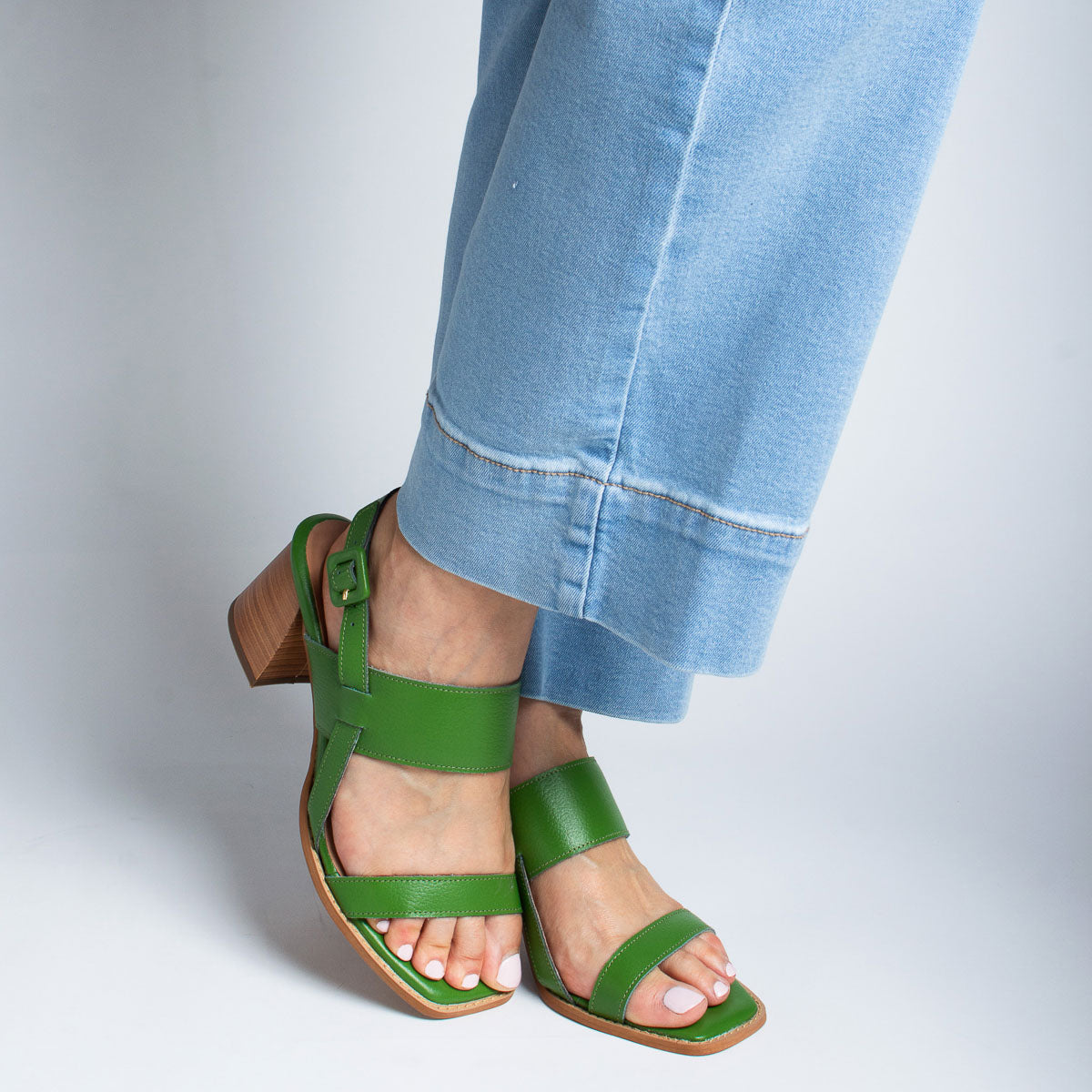 Woman wearing Begônia sandals with jeans - lifestyle ankle view