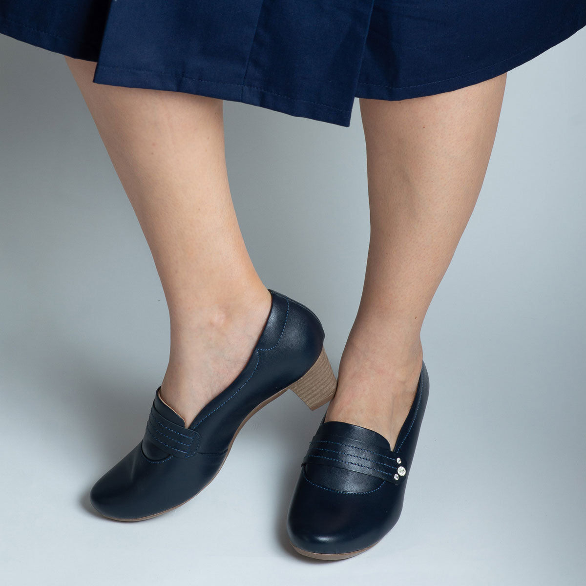 Woman wearing Canela shoes with navy trousers - lifestyle view