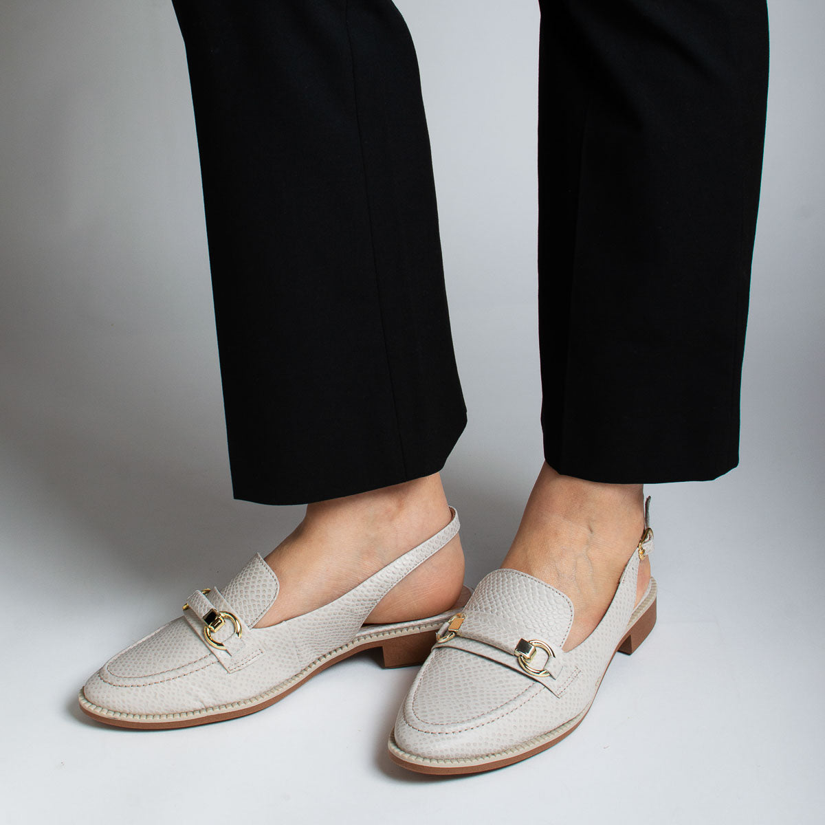 Woman wearing Maracujá loafers with black trousers - lifestyle view