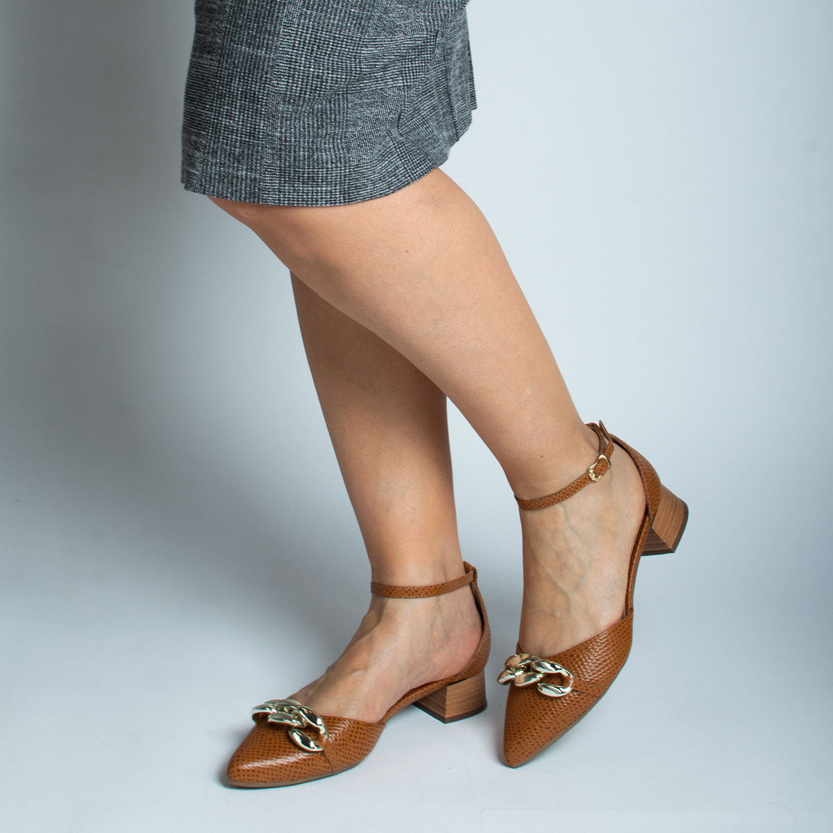 Woman wearing Jambo pumps with grey skirt - lifestyle view