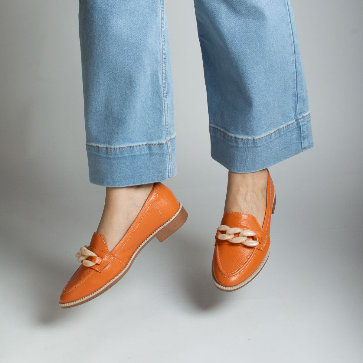 Woman wearing floater carrot Pitanga loafers with light blue jeans - lifestyle view