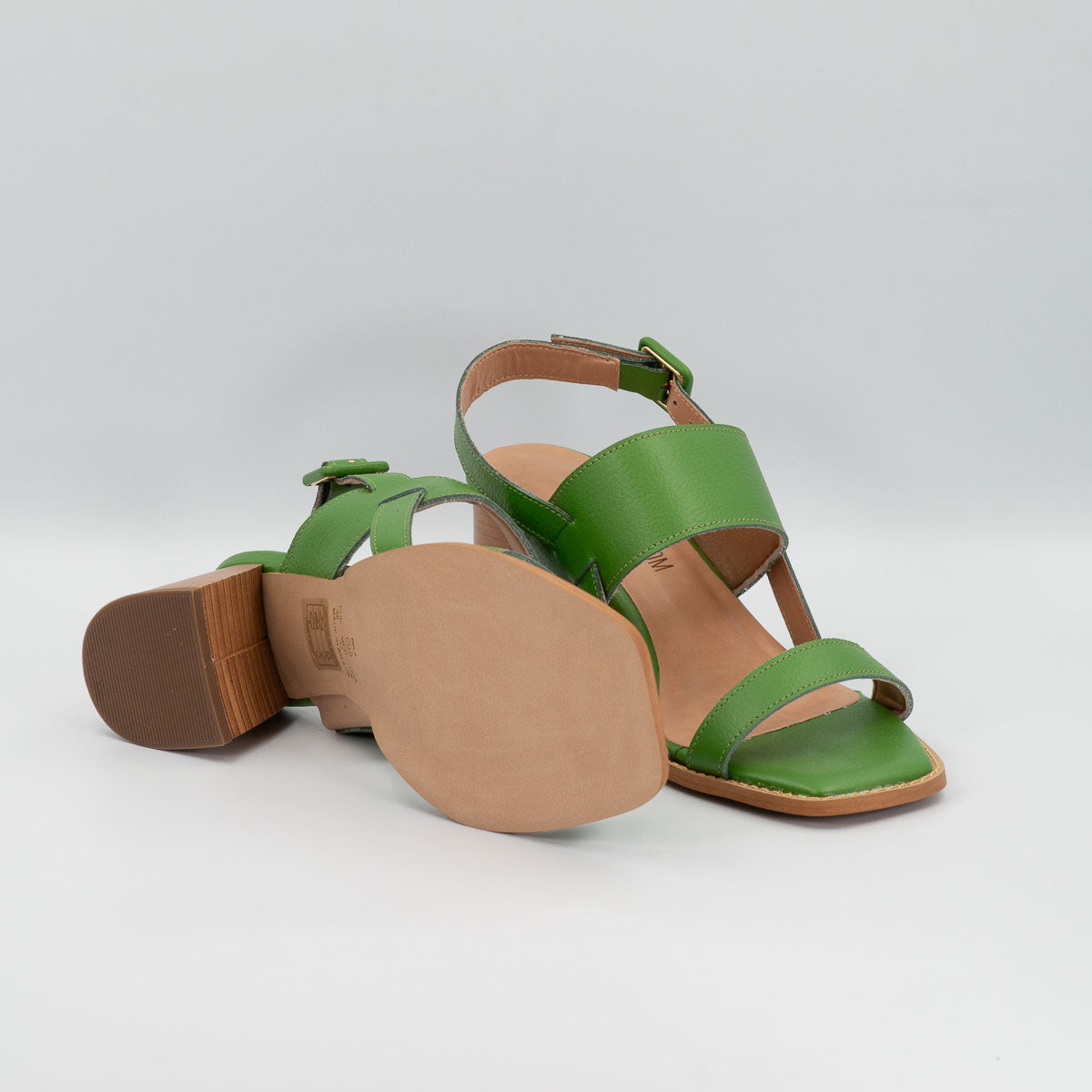 Terraloom Begônia sandals - side angle view green leather straps showing the soles