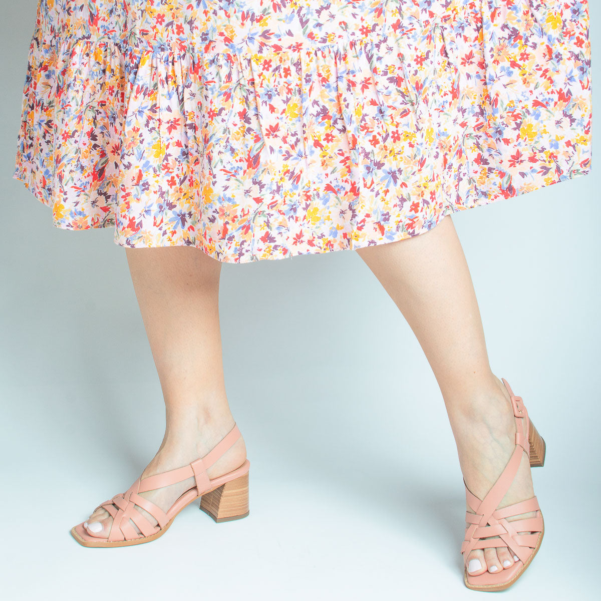 Woman's feet wearing Tulipa sandals with floral dress - lifestyle view