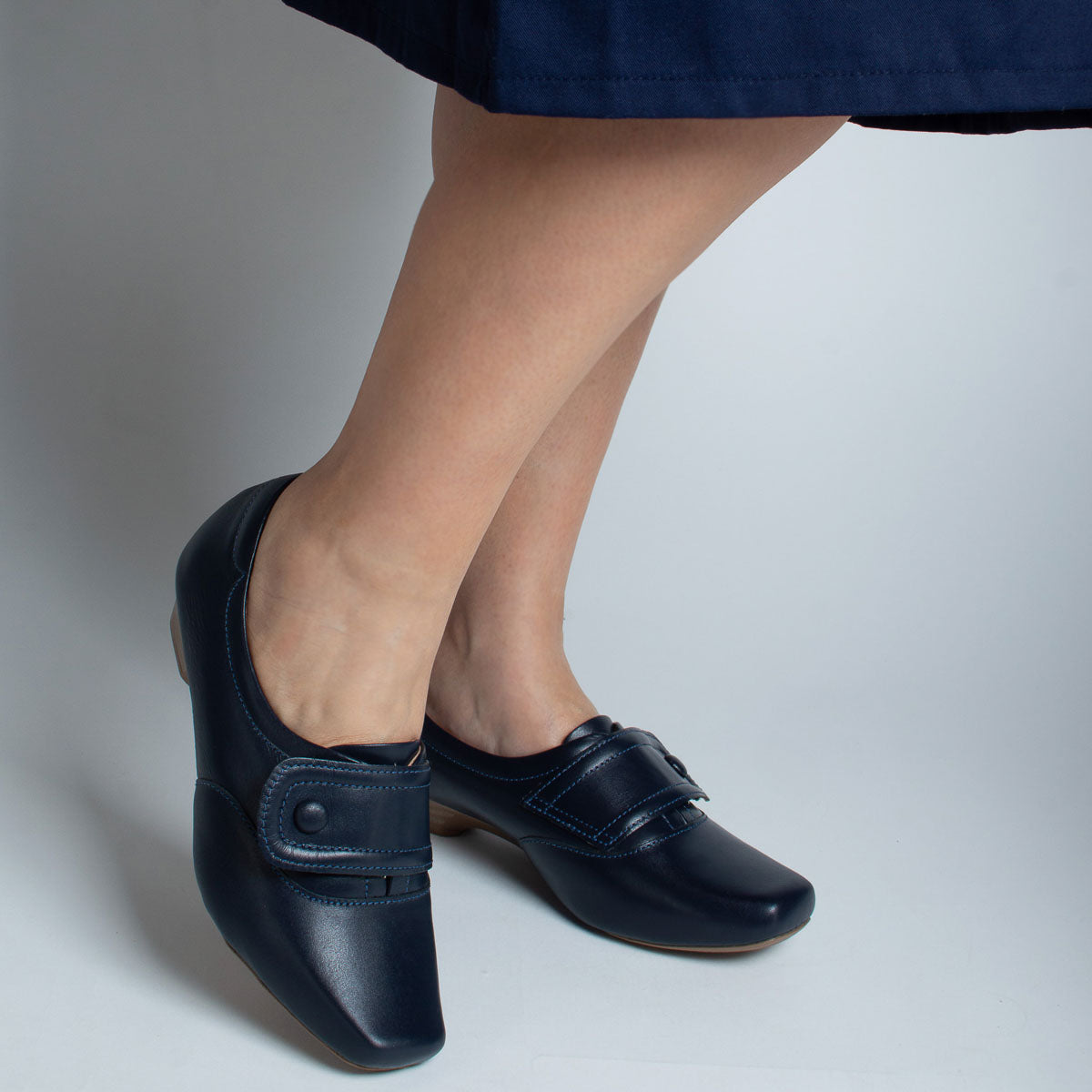Woman wearing Peroba shoes with navy trousers - lifestyle view