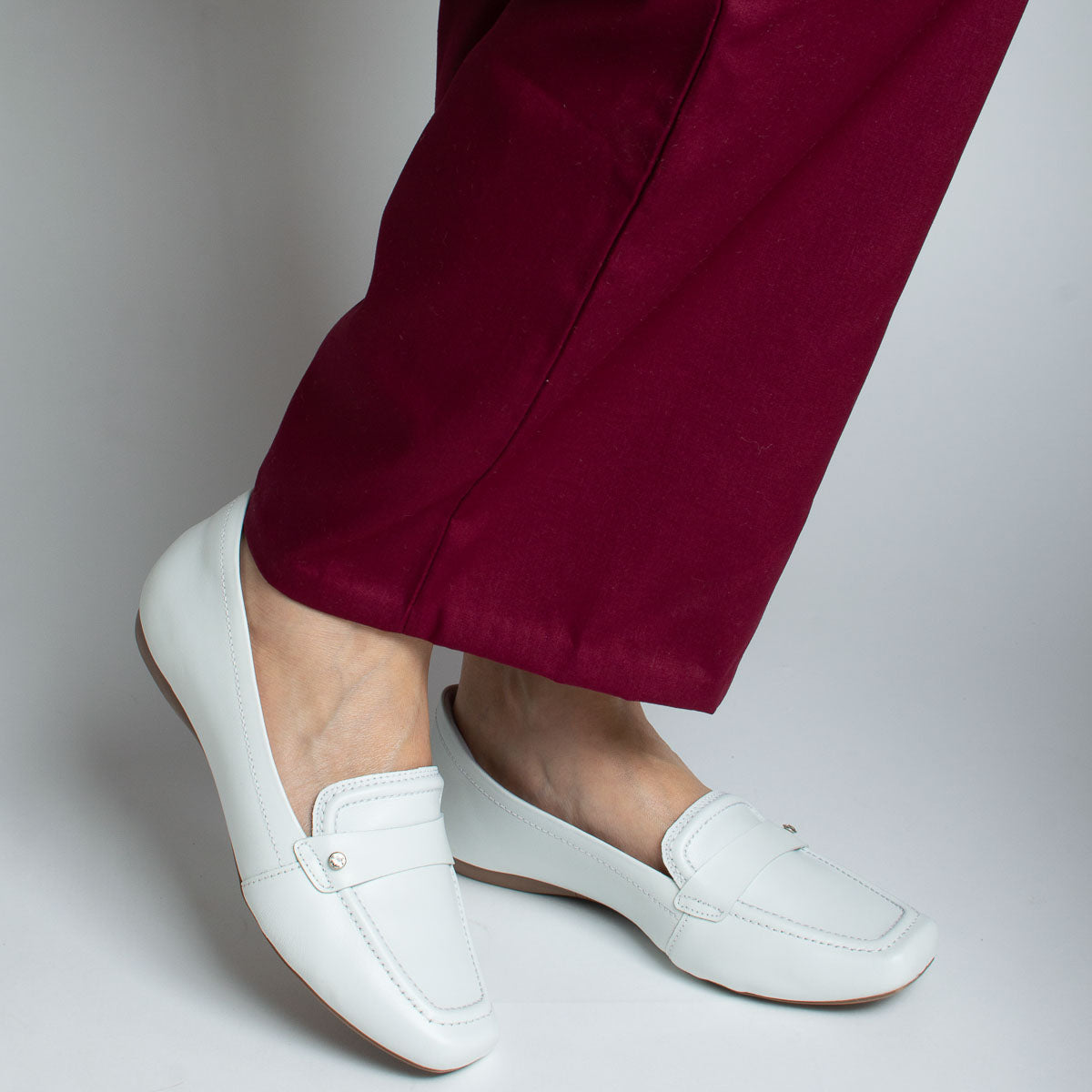 Woman wearing Cedro shoes with burgundy trousers - lifestyle view