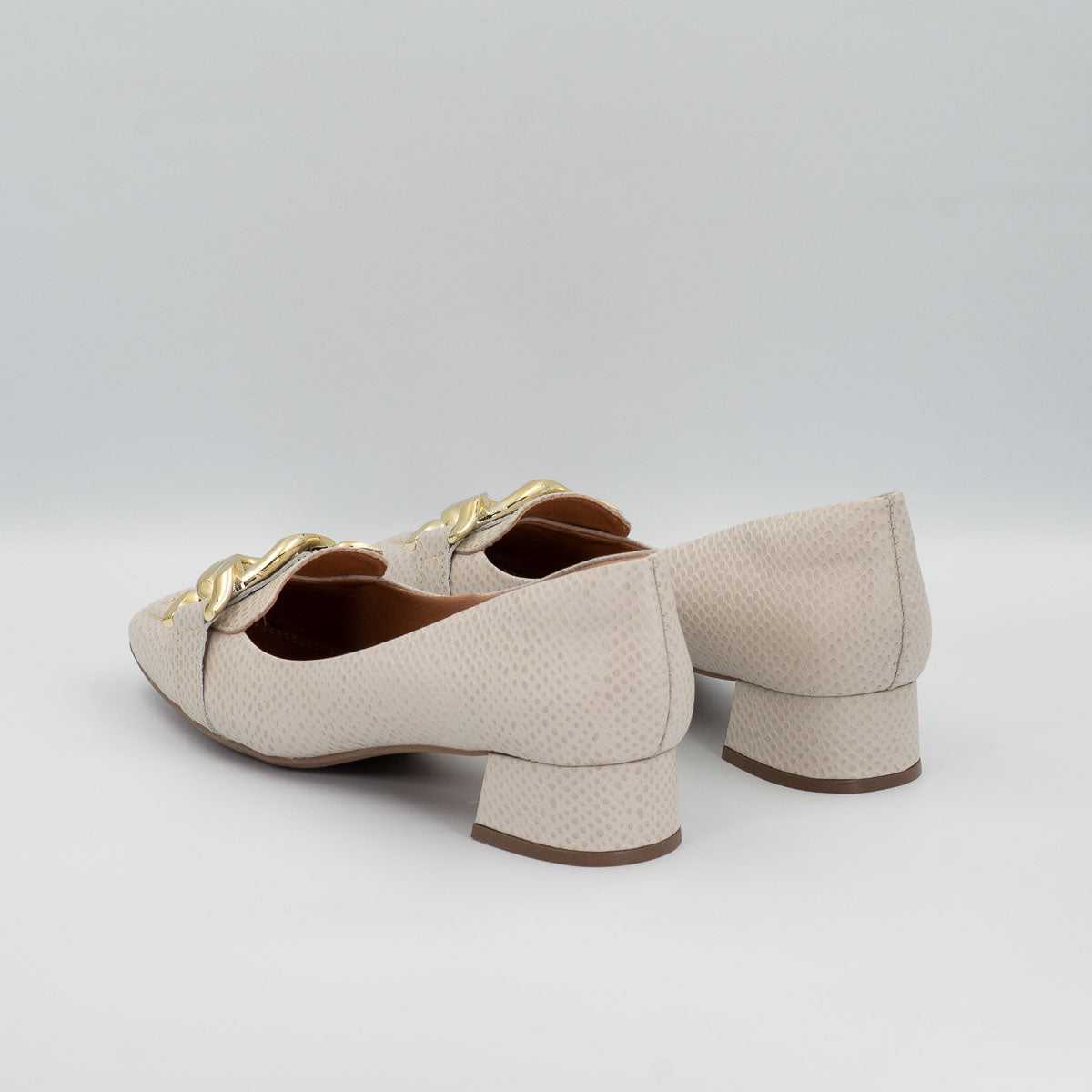 Coentro buckle pumps - three-quarter view scale off-white
