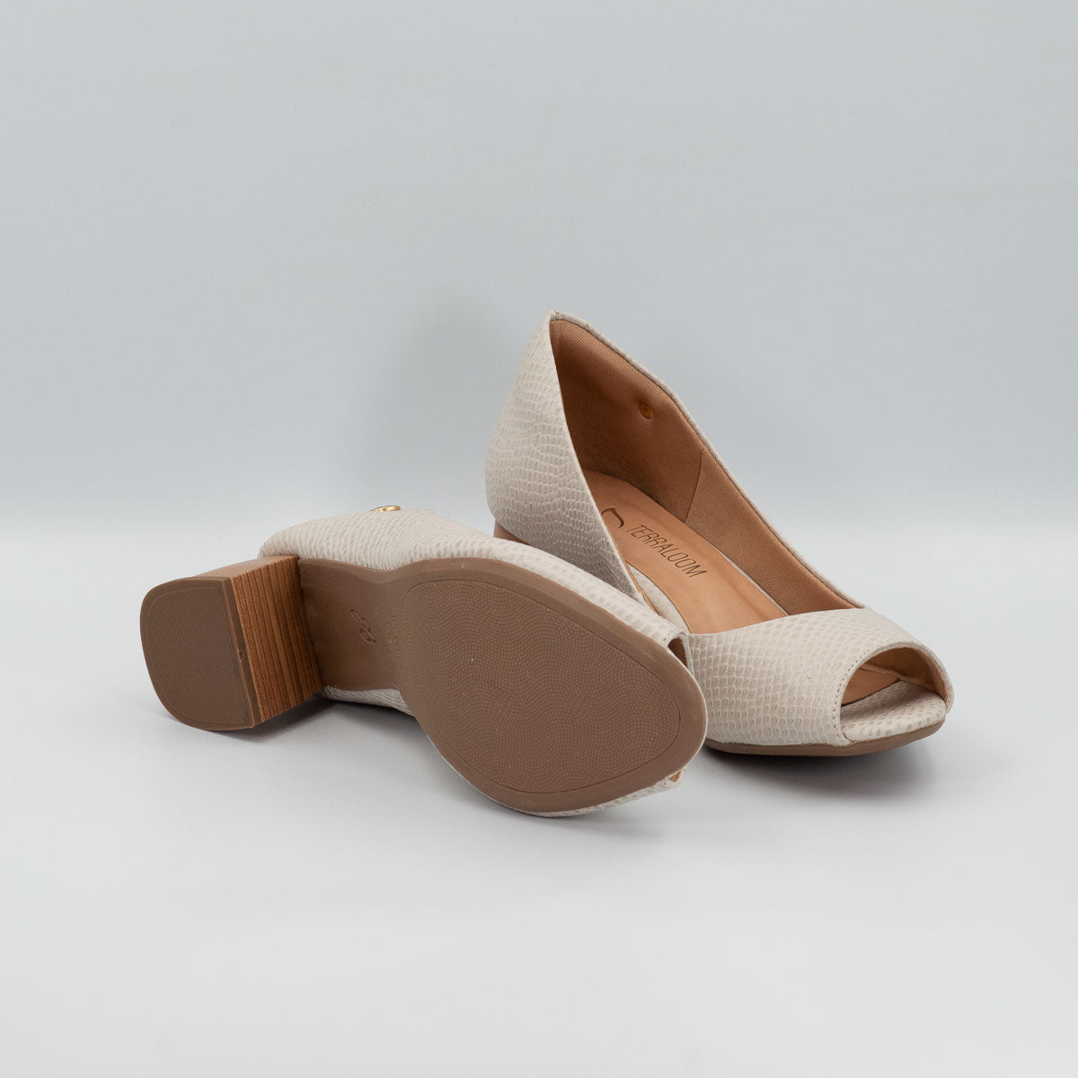 Erva-doce pumps - front view showing peep toe design and bottom sole