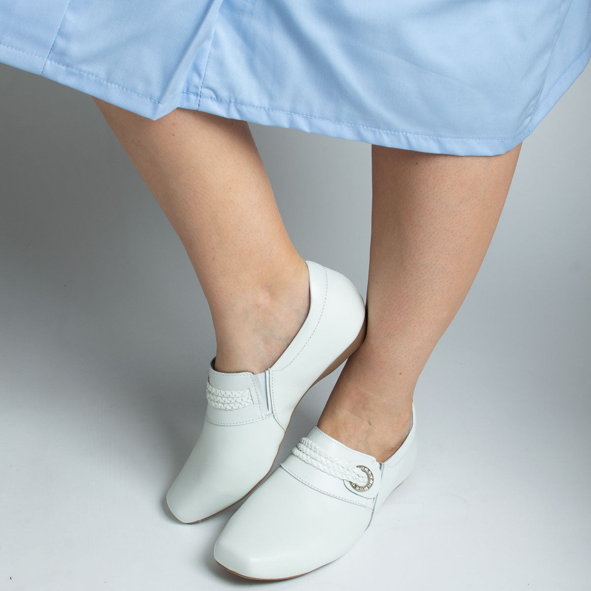 Woman wearing Ipê shoes with light blue top - lifestyle view