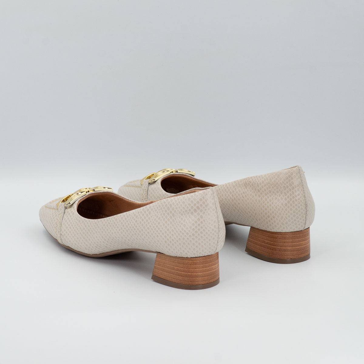 Manjericão buckle pumps - three-quarter view scale off-white