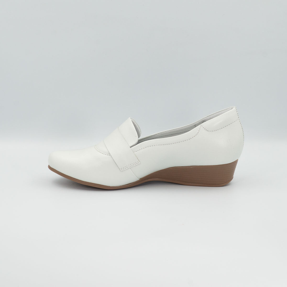 Seringueira comfort shoe - left side profile view showing stacked low wedge heel