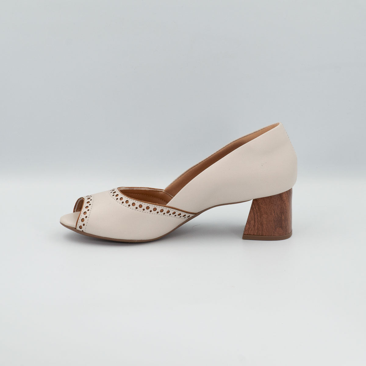 Urucum peep toe pump - left side profile view showing stacked heel