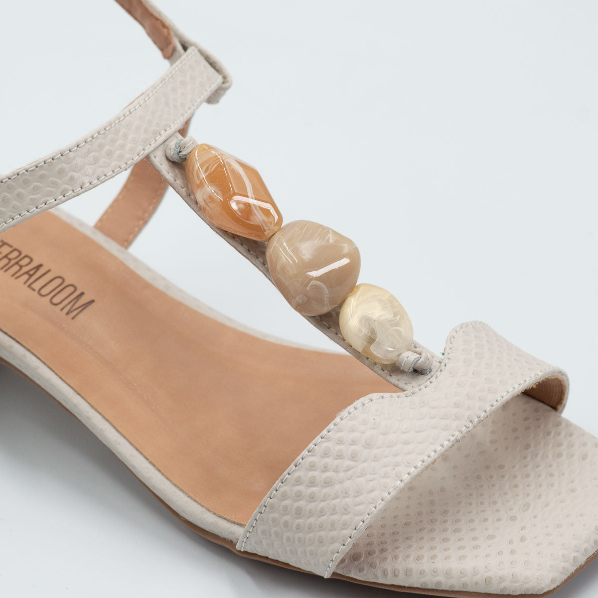 Terraloom Violeta sandal - close-up detail view scale off-white leather