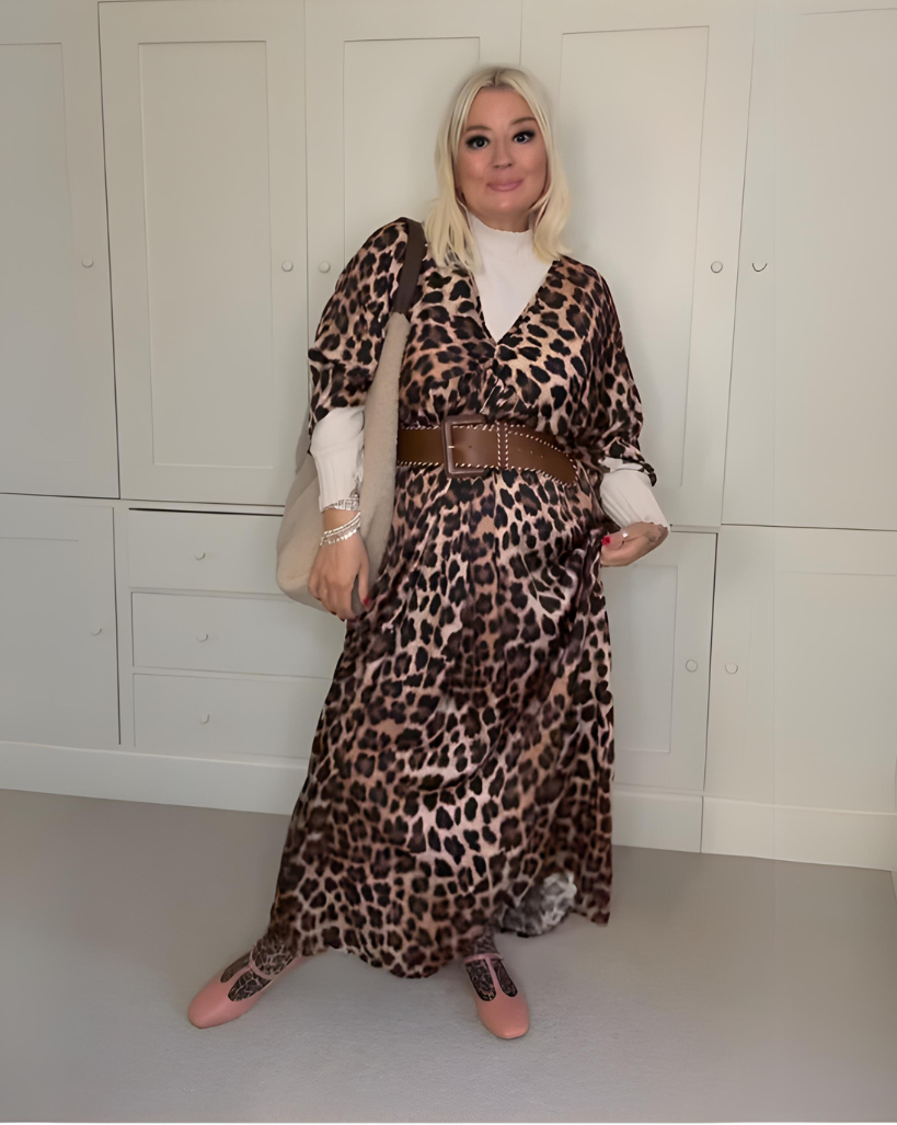 Woman wearing comfortable Terraloom shoes with leopard print maxi dress and brown belt - customer styling inspiration
