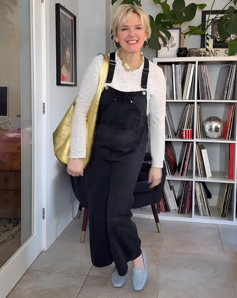Woman wearing comfortable Terraloom shoes with black dungarees and white jumper - customer styling inspiration